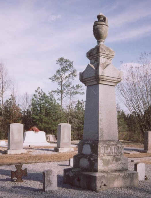 Tall monument topped with an urn in the Black family plot