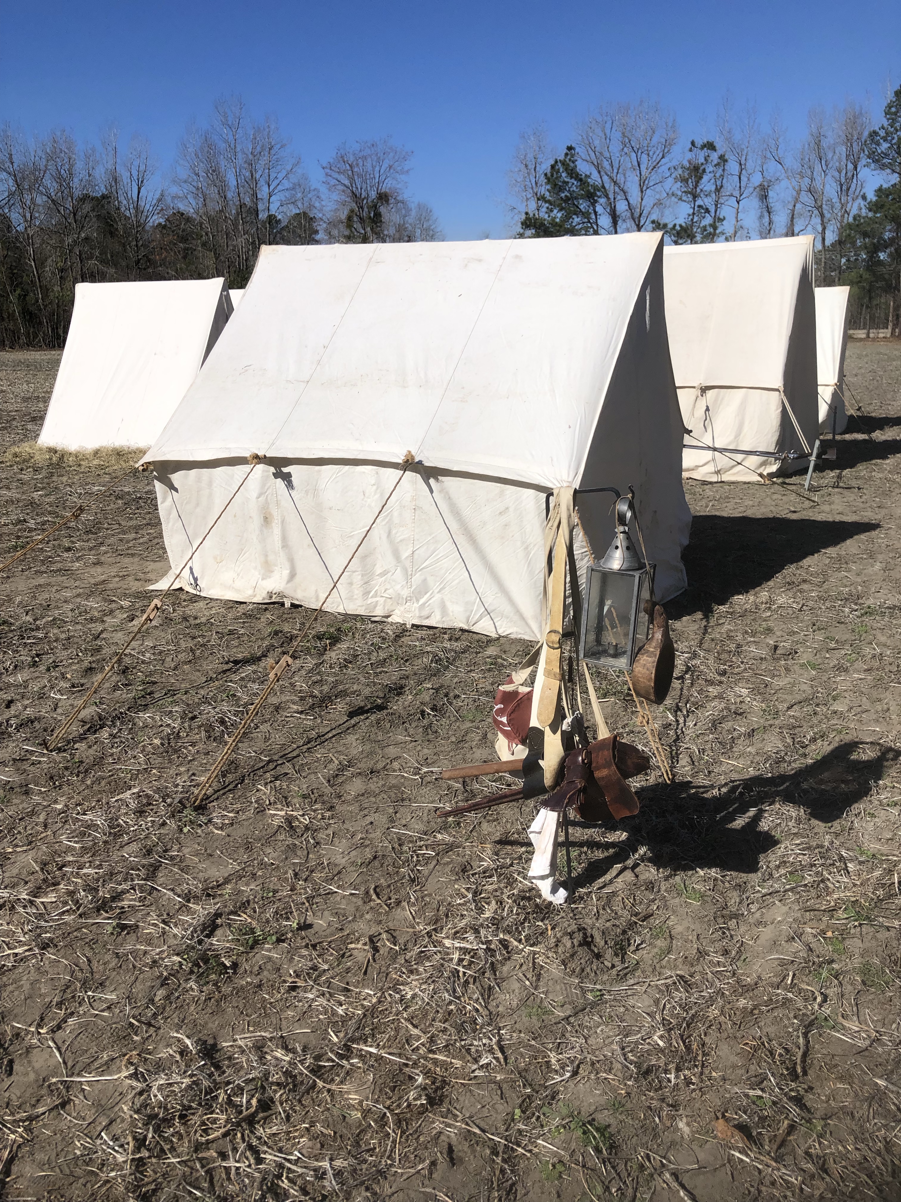 White canvas tents at the reenactors' camp