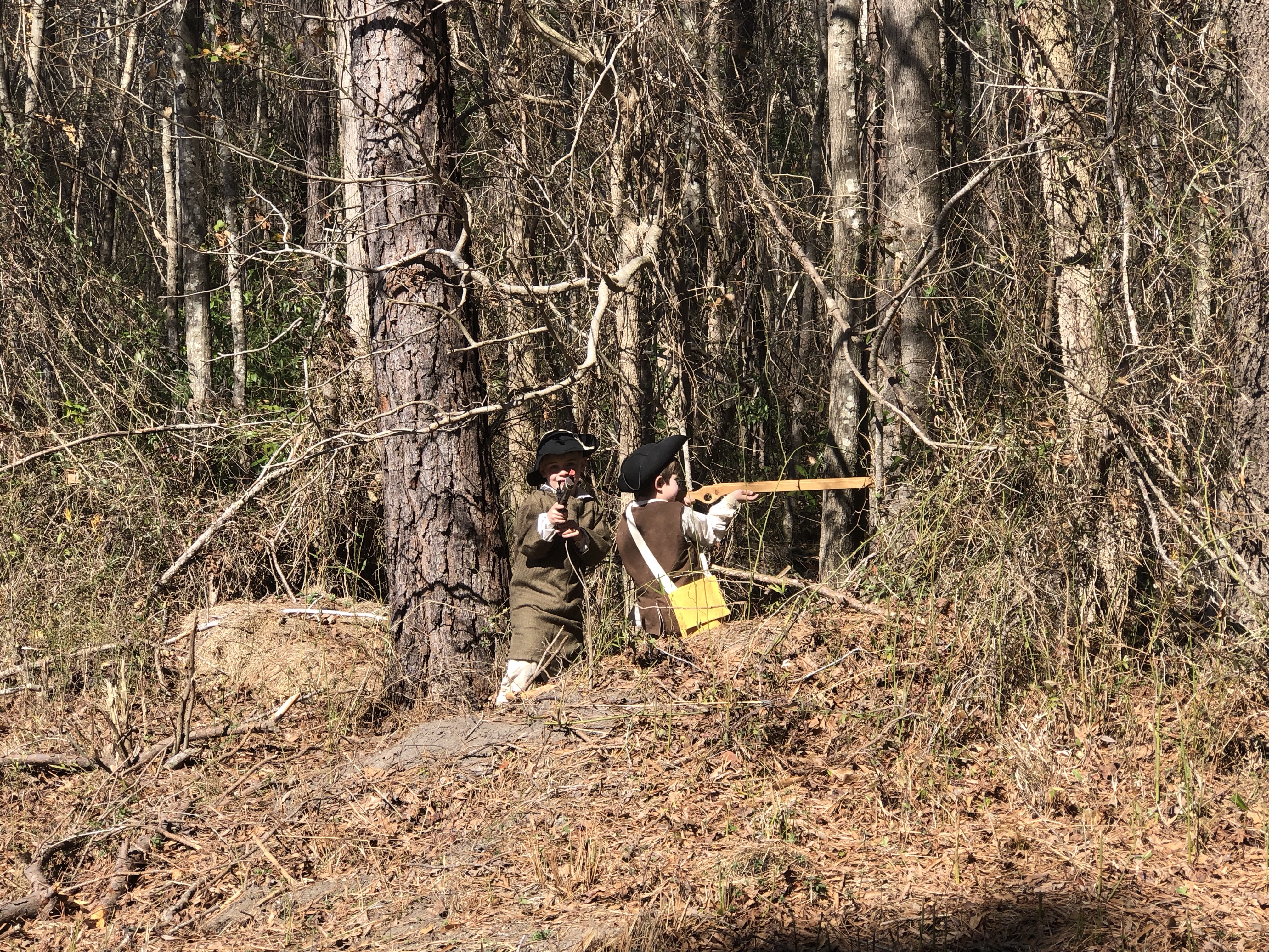 Reenactor at work among the trees at the American Heritage Festival