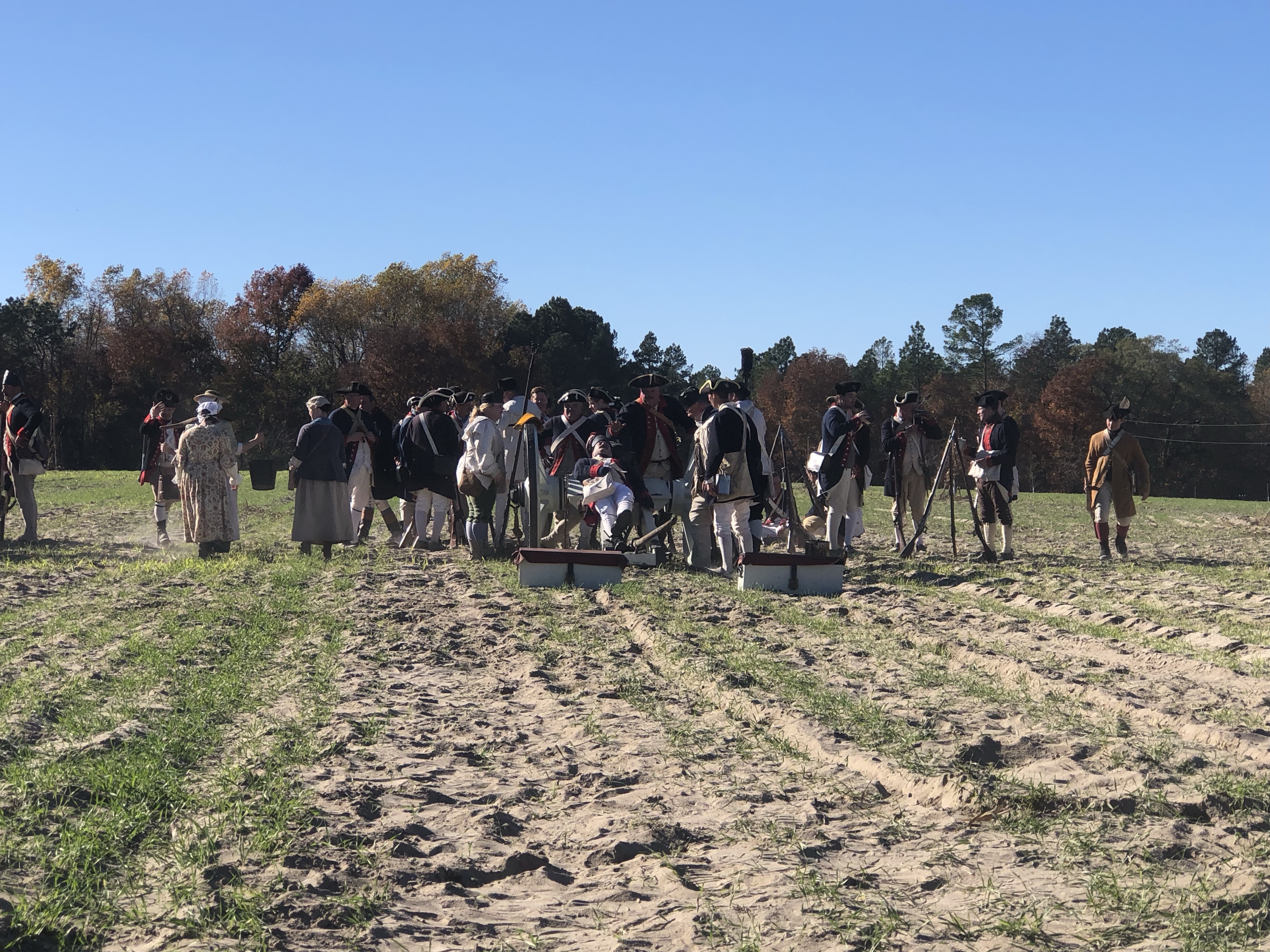 Reenactors gathered on the open field during the battle demonstration