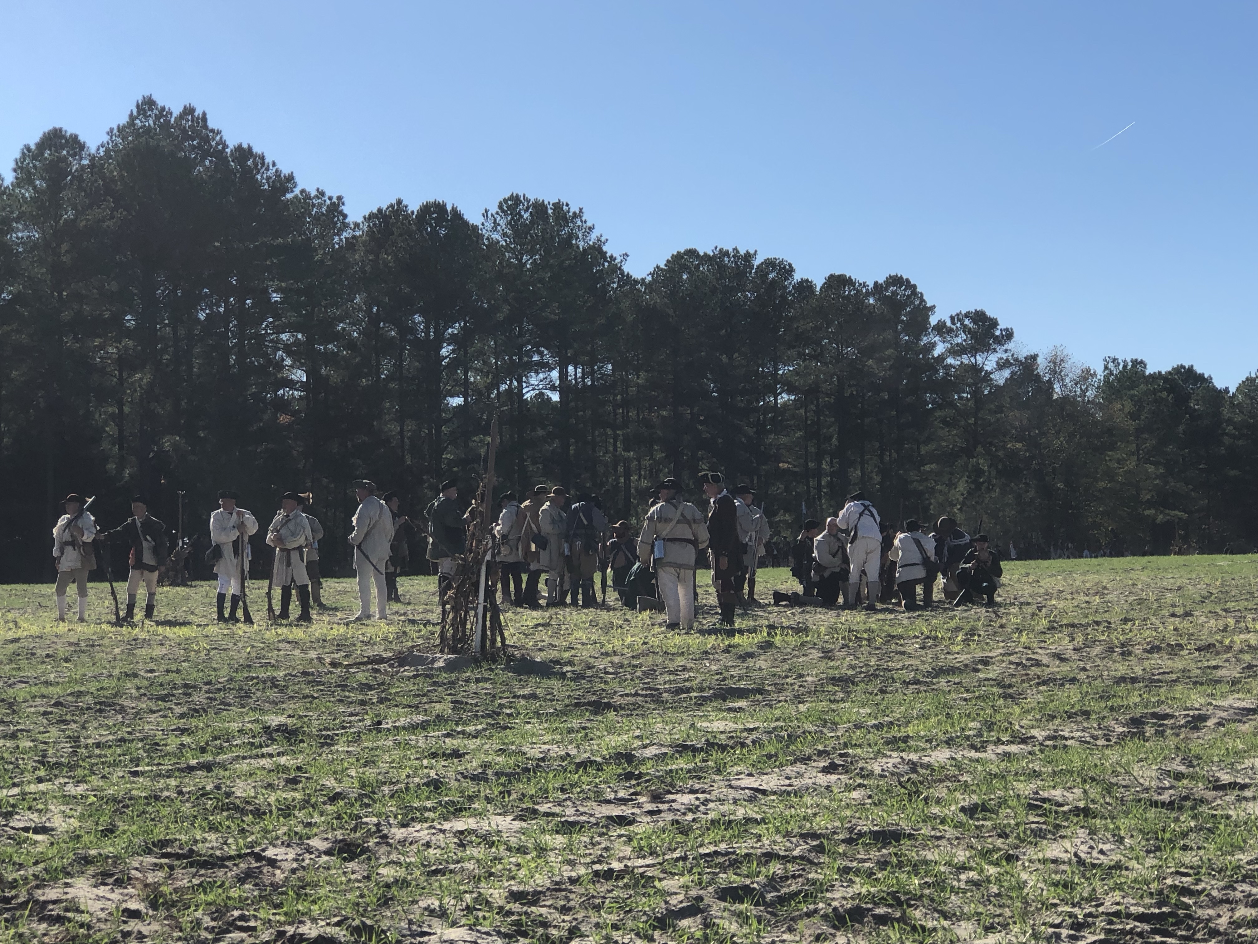 Lines of reenactors spread across the open field