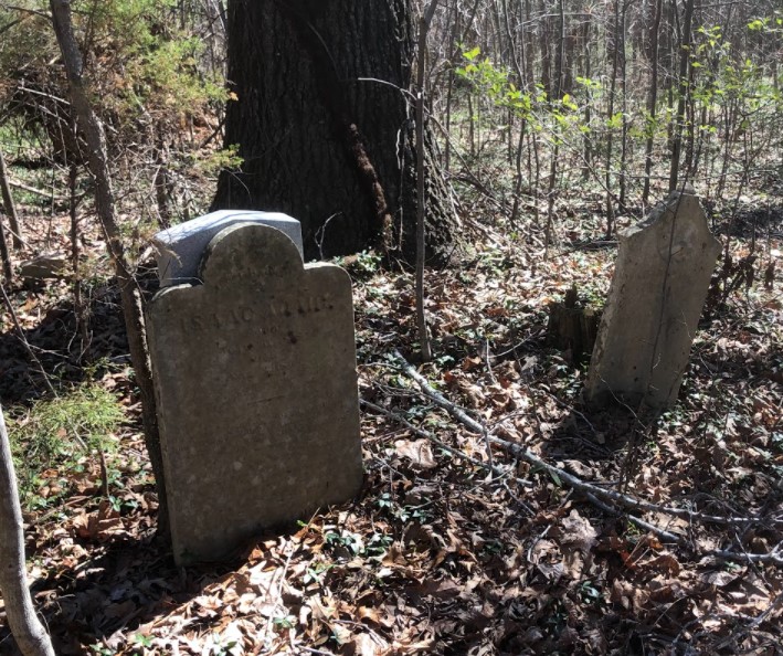 Isaac Adair's stone with a military marker behind it, 2022