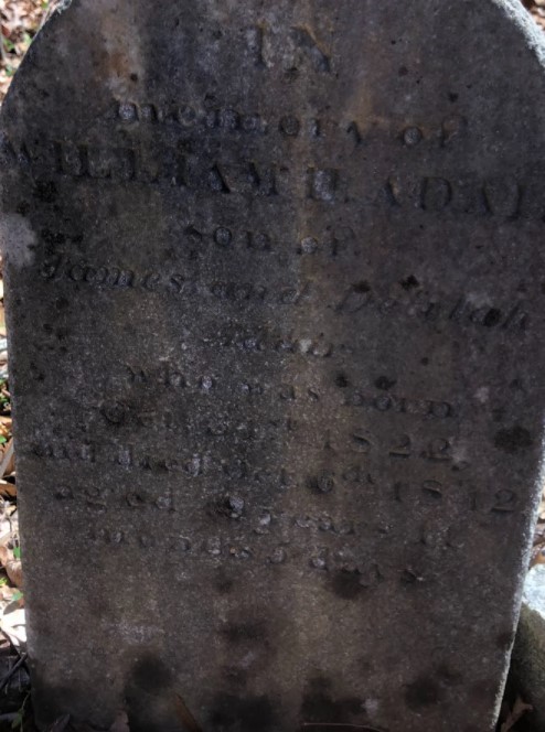 Worn gravestone of William Adair, son of James and Delilah Adair