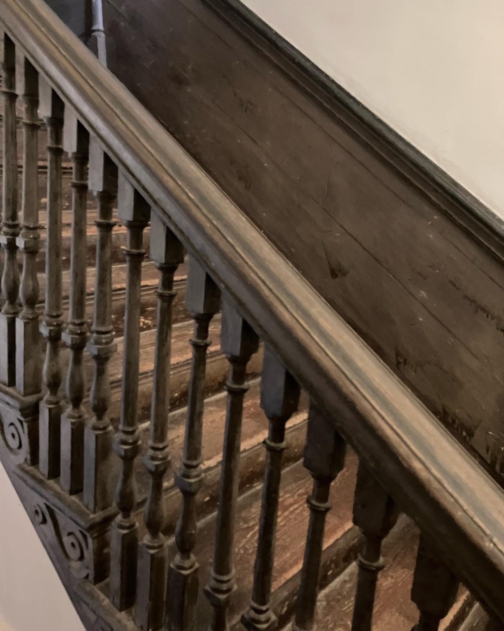 Close view of the stair rail and turned balusters