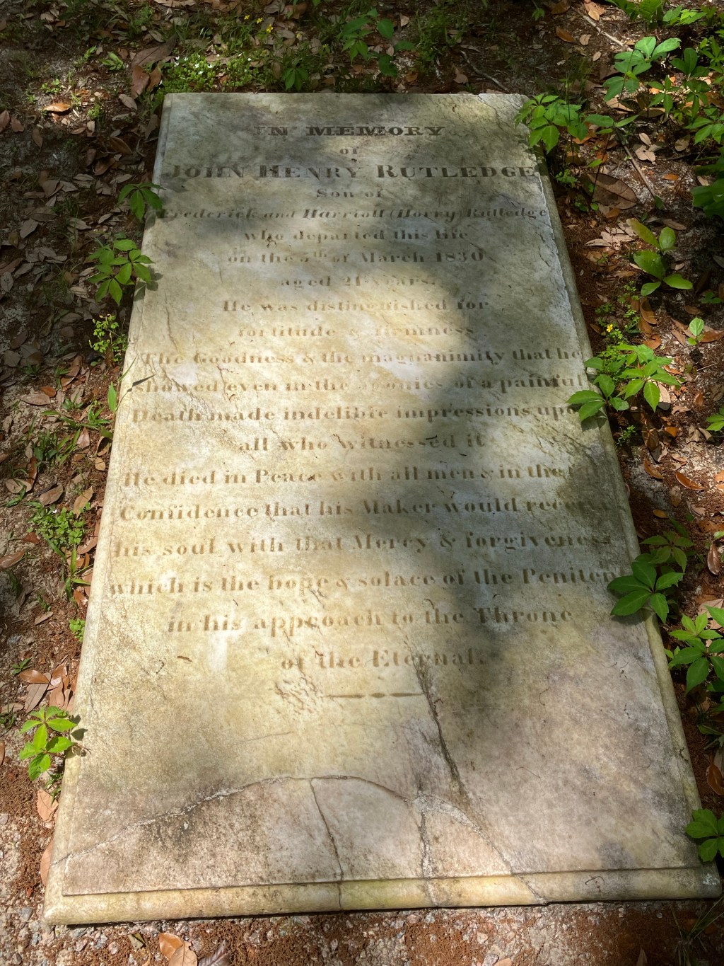 Inscribed marble ledger stone in the grass