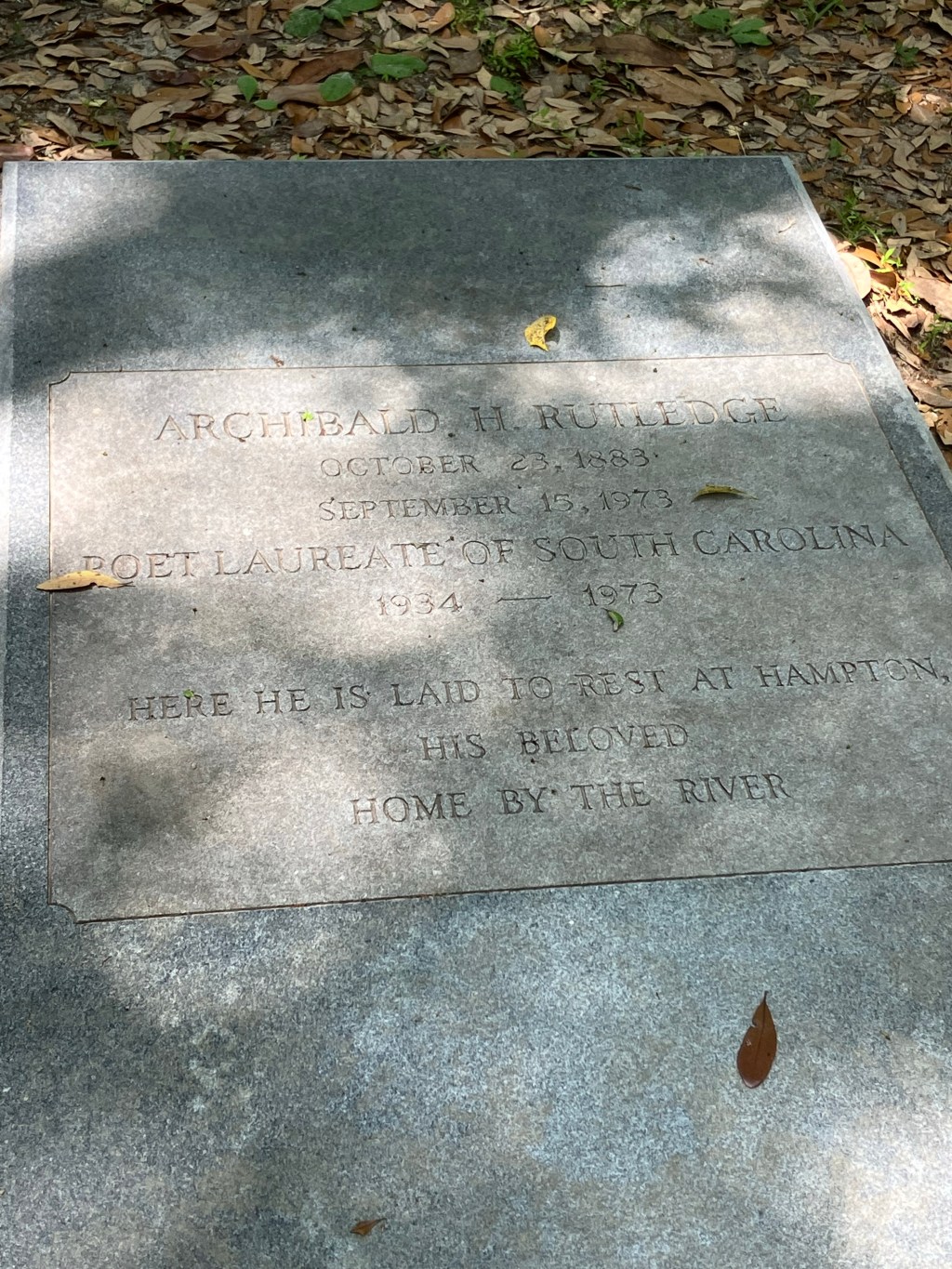 Close view of the inscription on a marble ledger stone