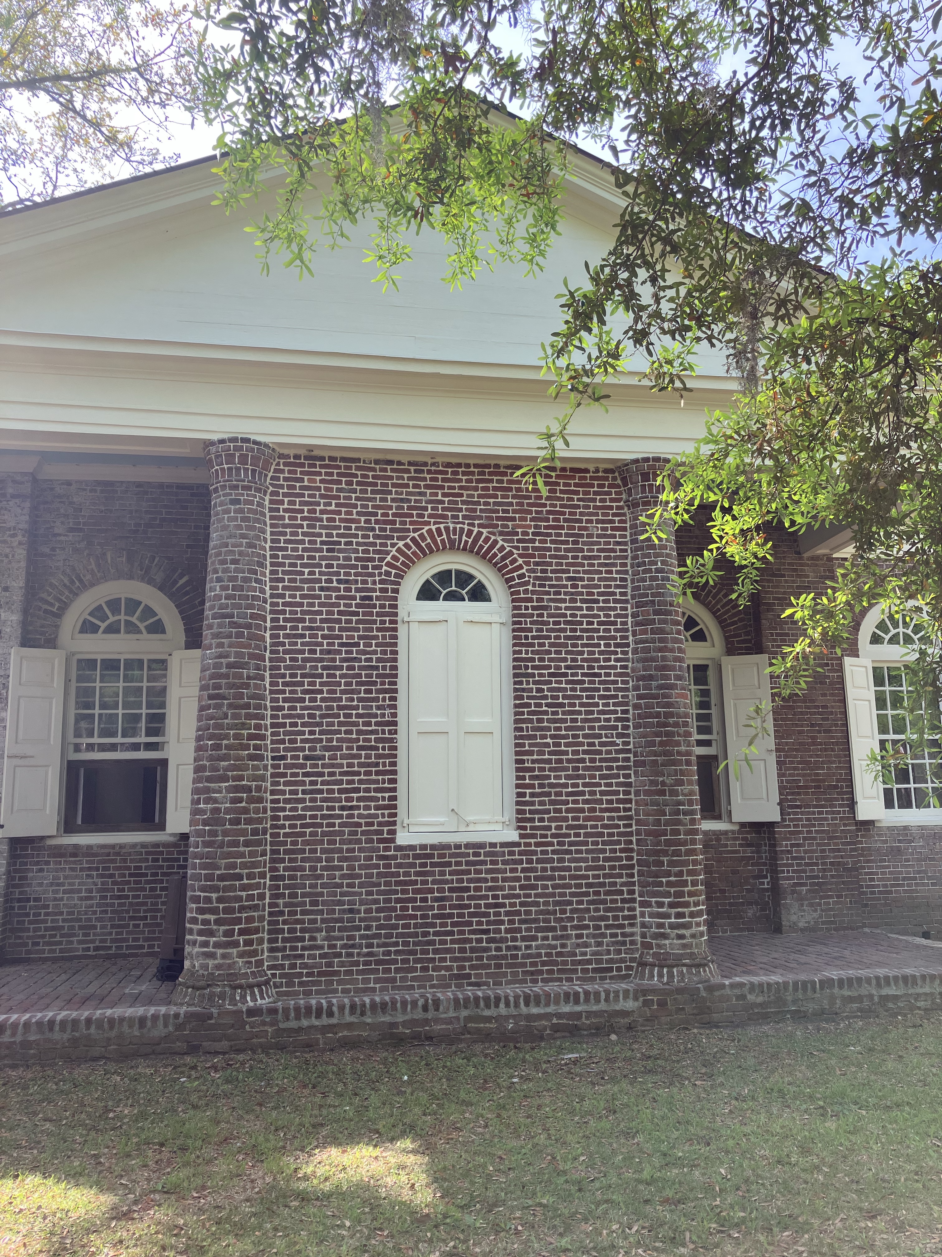 The bricked-up second entrance on the side of the church