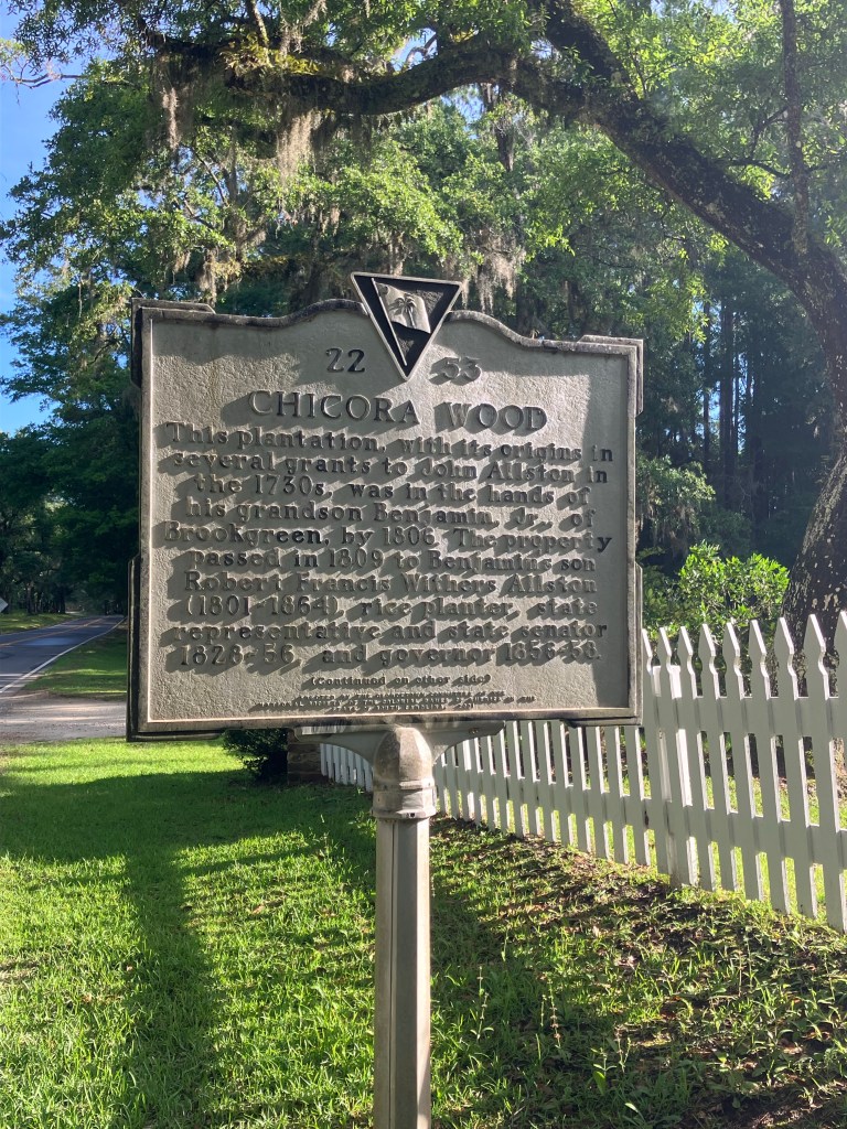 Historical marker beside a white picket fence under the oaks at Brattonsville