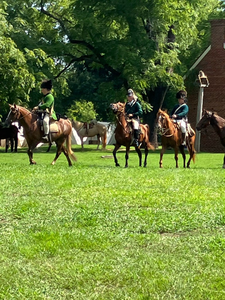 Reenactors on horseback on the field at Huck's Defeat