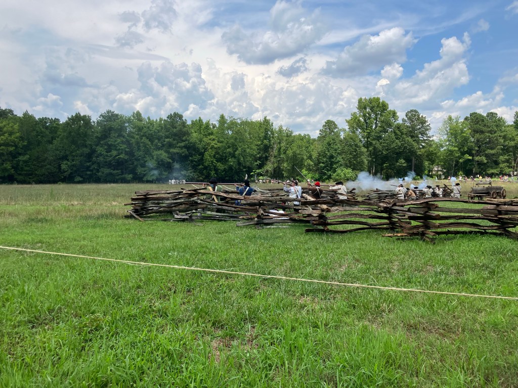 Musket smoke along a rail fence during the Huck's Defeat reenactment at Historic Brattonsville