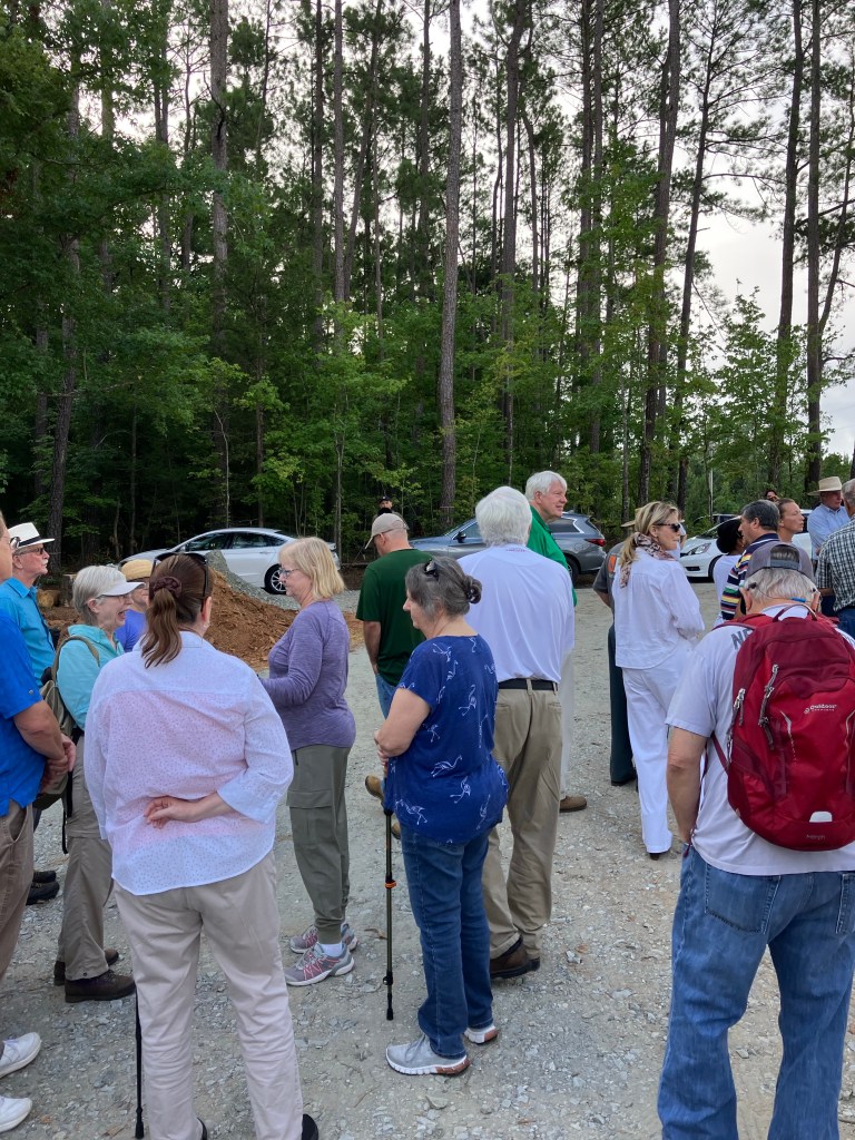 Tour group gathered on the gravel road at Hammond's Old Store