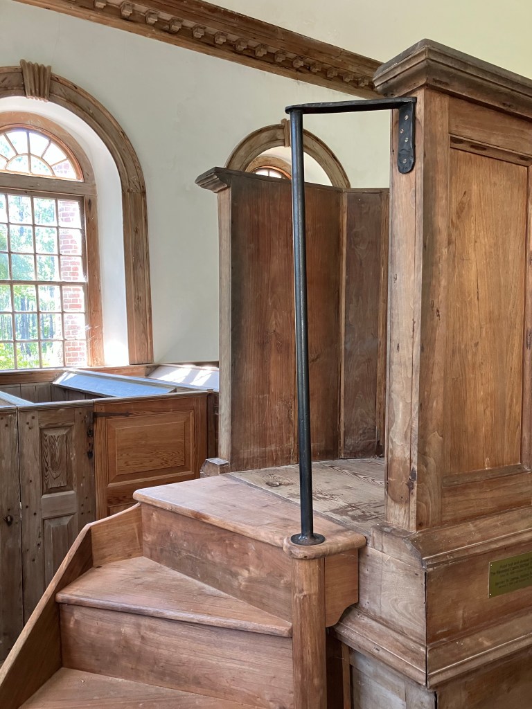 Wooden stairs leading up to the pulpit