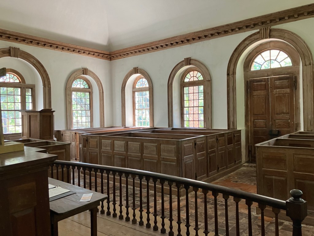View over the chancel rail toward the box pews