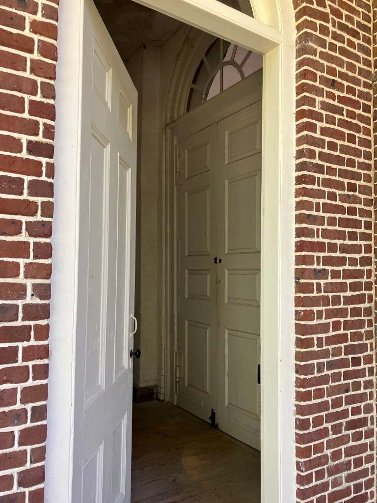 Doorway through the thick brick wall