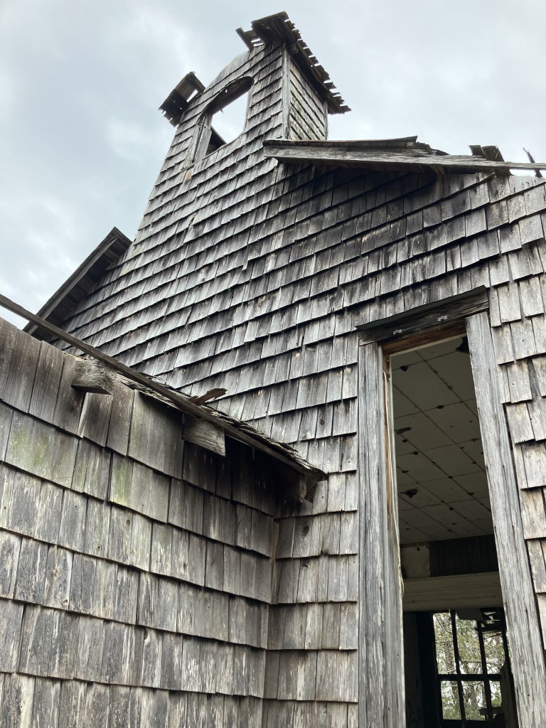 Bell tower and shingled walls of Halfway Creek Church