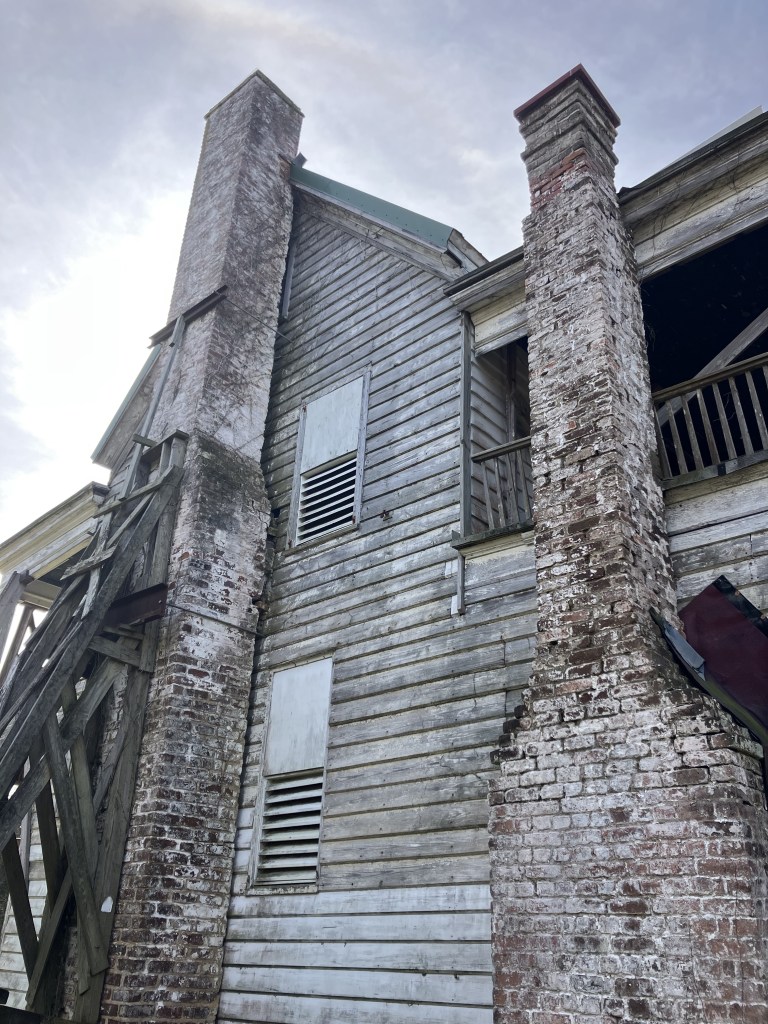 Two brick chimneys on the end of the Tibwin house