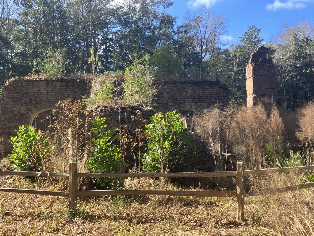 Front of the Eldorado Plantation ruins behind a rail fence, January 2023