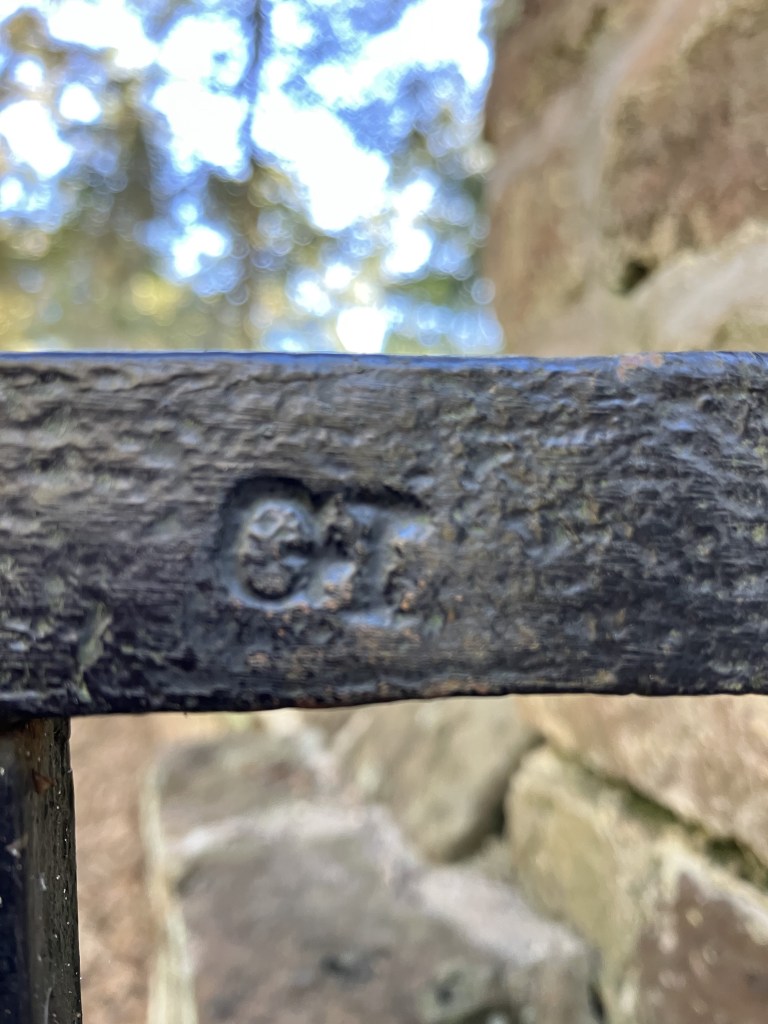 Close view of the ironwork on the cemetery gate
