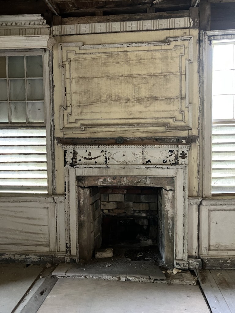 Fireplace with a carved overmantel panel