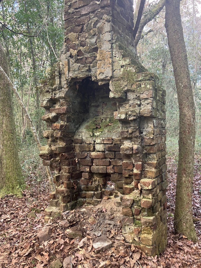 Open firebox of the crumbling cabin chimney