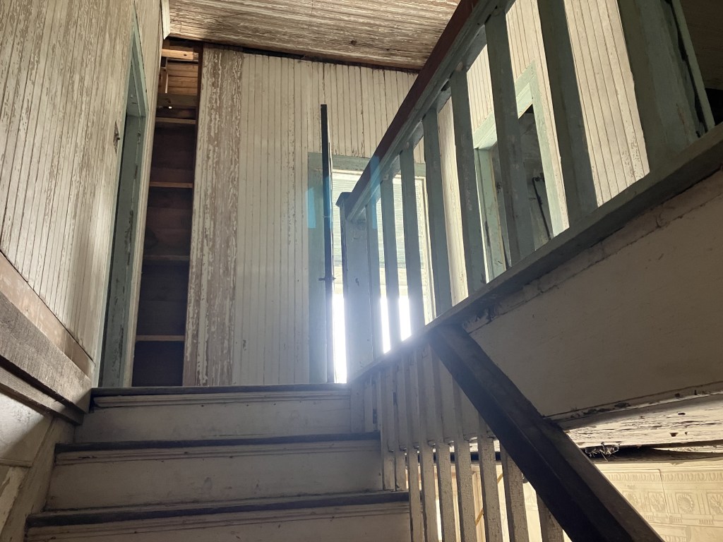Stair landing and railing inside the Tibwin house