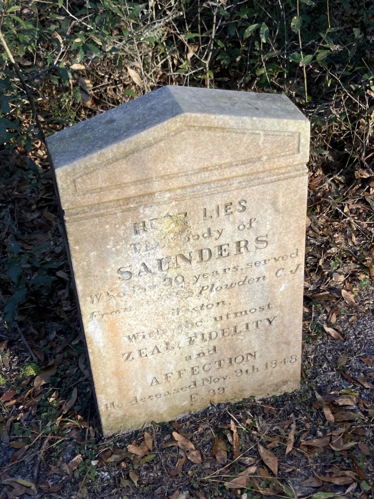 Marble headstone reading Here lies the body of Saunders