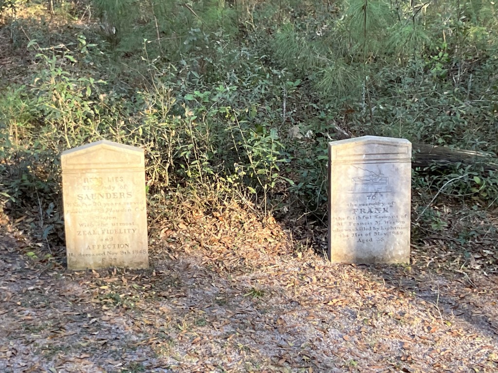 Two white headstones for Saunders and Frank