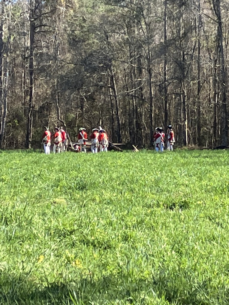 British redcoat reenactors in the green field