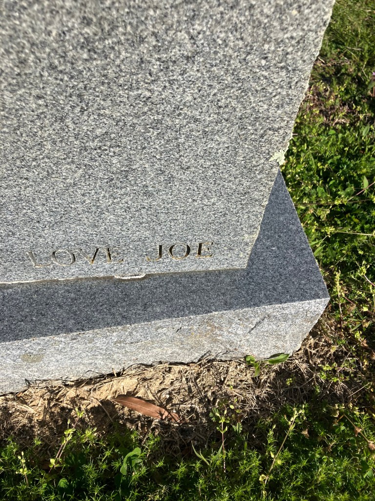 Close view of the edge of a polished granite headstone