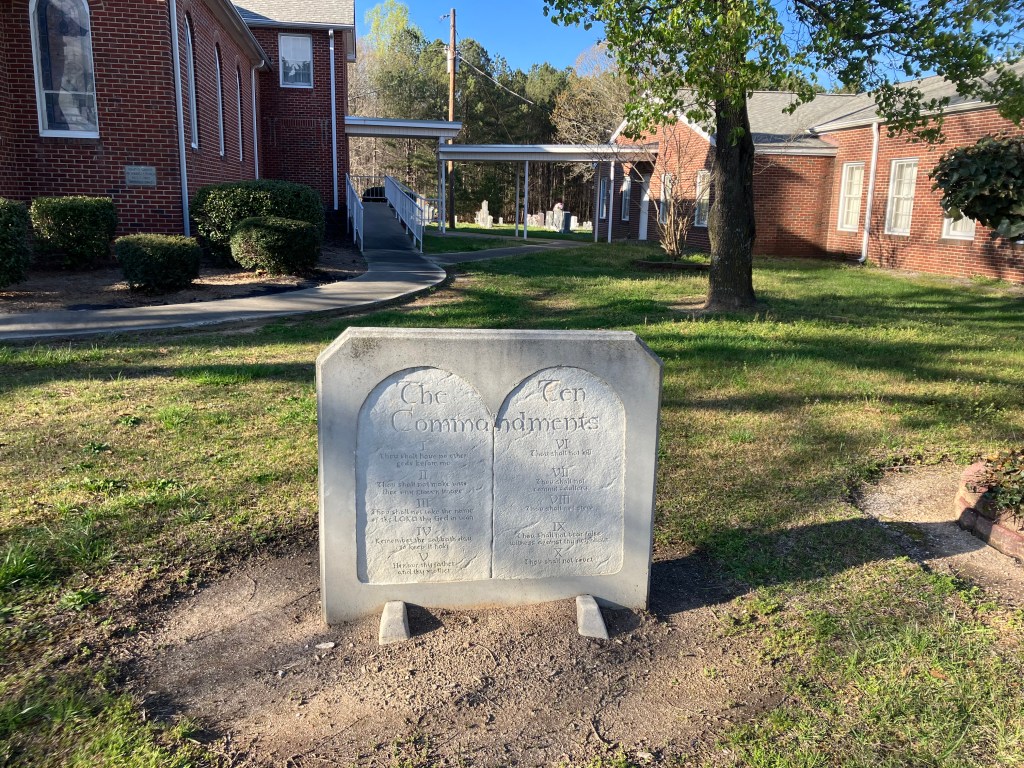 Ten Commandments stone monument on the lawn of Mary's Grove Community Church