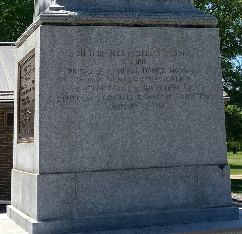 Side of the granite base of the Cowpens monument with a carved inscription