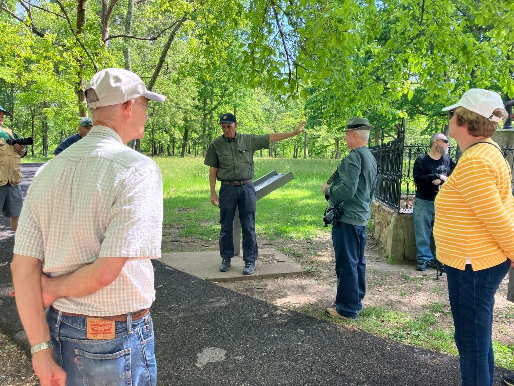 Group of visitors listening to a guide on the Cowpens battlefield trail