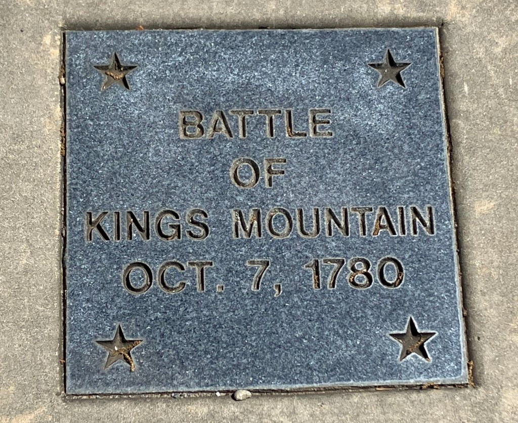 Engraved stone tile reading Battle of Kings Mountain, Oct. 7, 1780