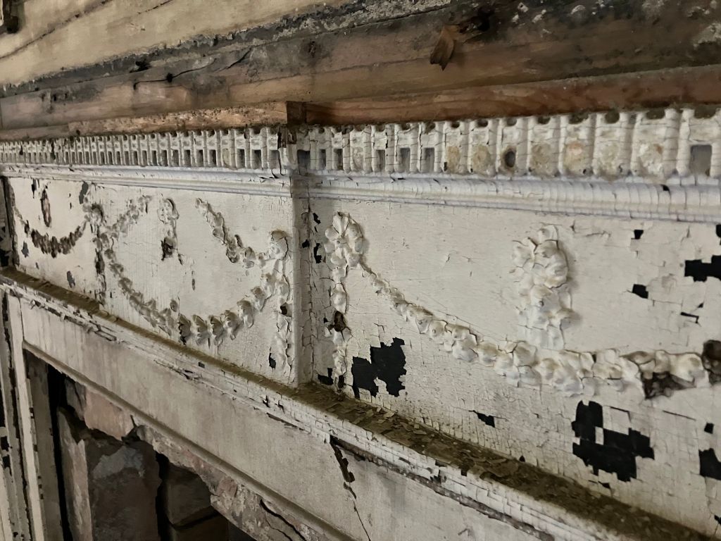 Close view of a carved frieze with swags