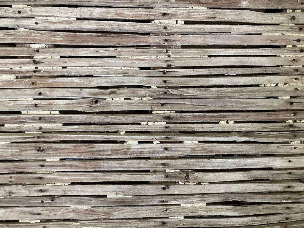Wall of exposed wooden lath