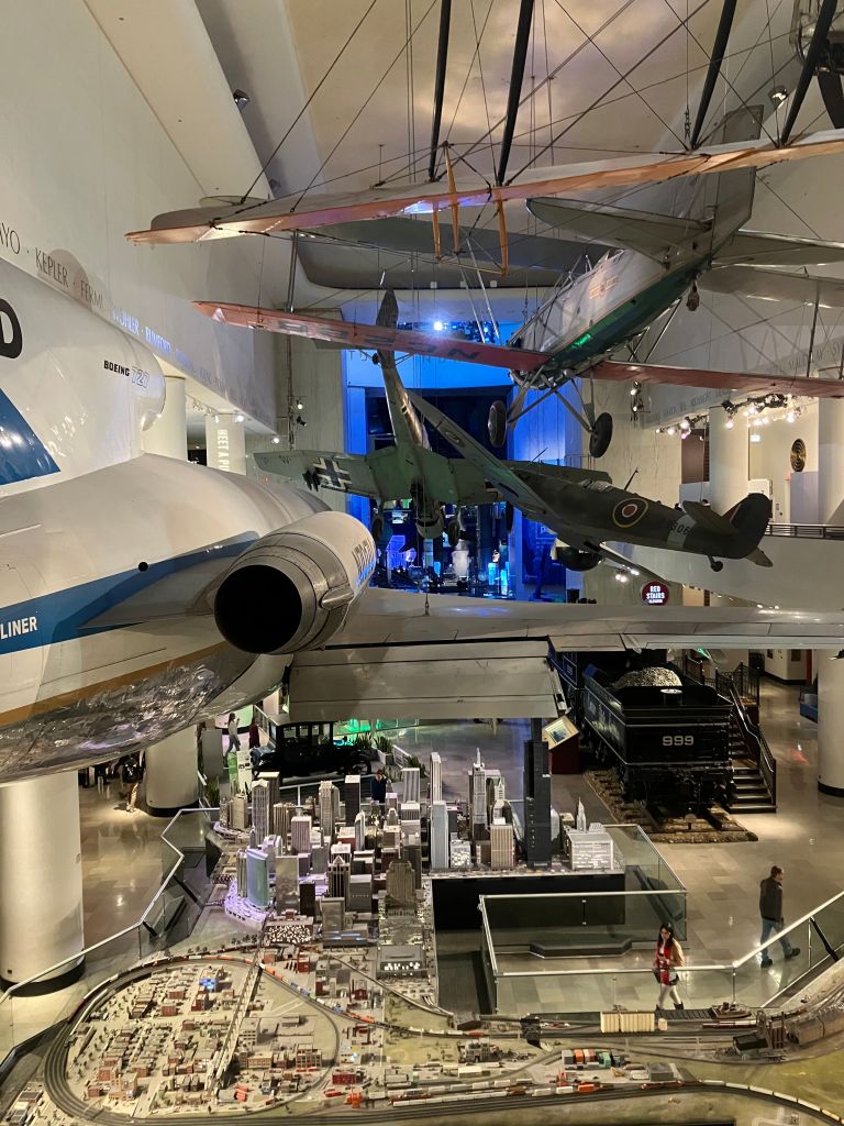 Airliner and vintage planes hanging above the model railroad in the Transportation Gallery