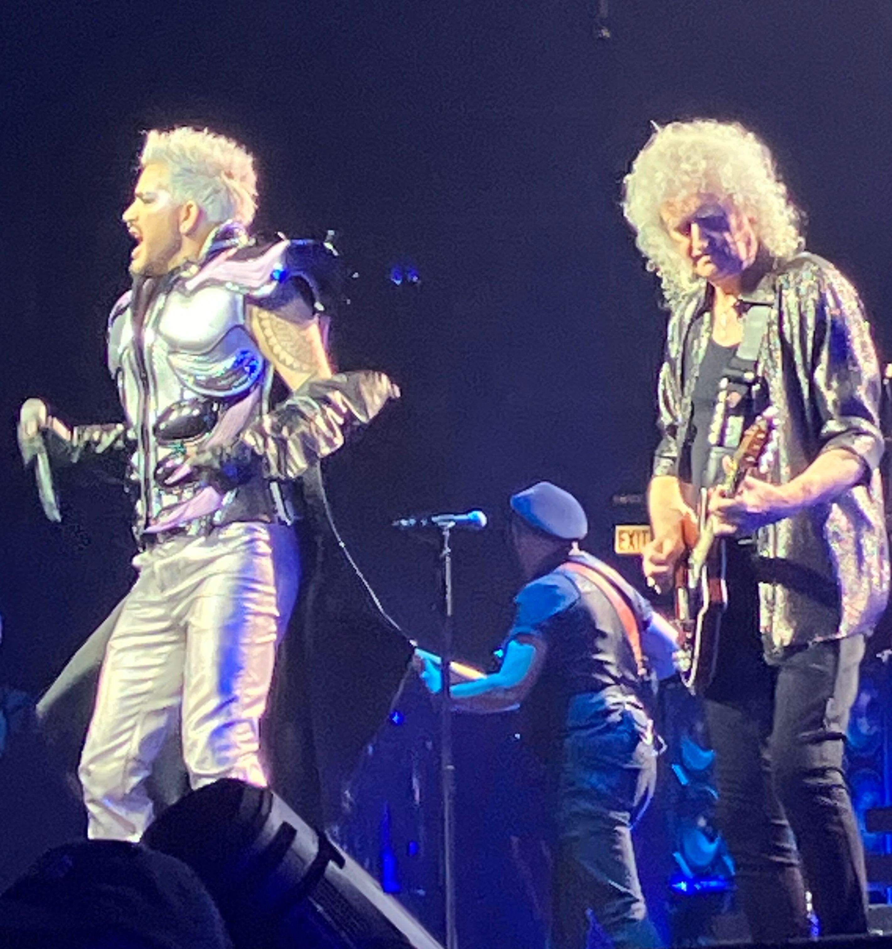 Adam Lambert and Brian May performing together on stage