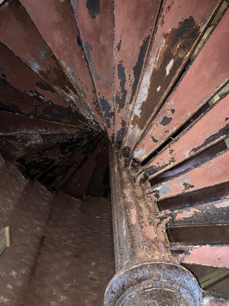 Looking up the iron spiral stair inside the Cape Romain Lighthouse