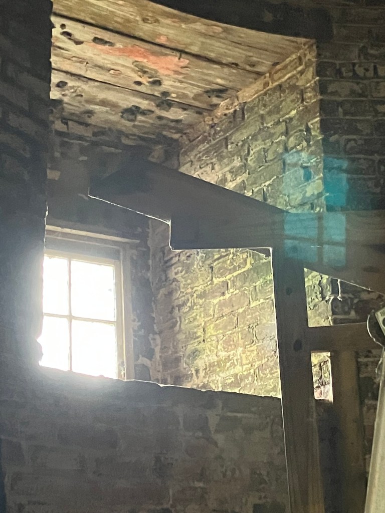 Light coming through a window inside the lighthouse tower
