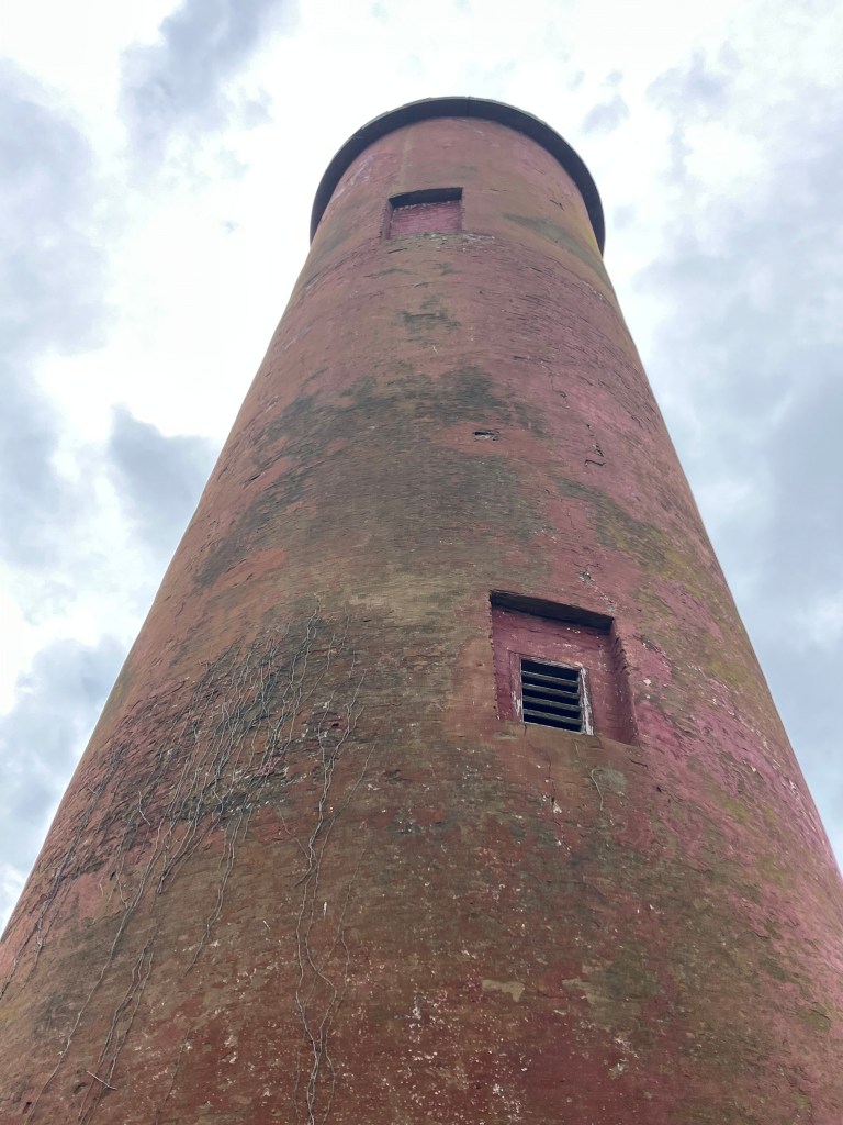 Window in the red brick of the 1827 lighthouse