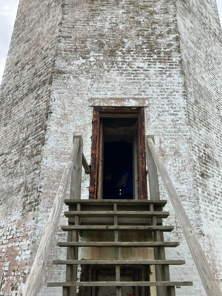 Wooden stairs leading to the lighthouse doorway