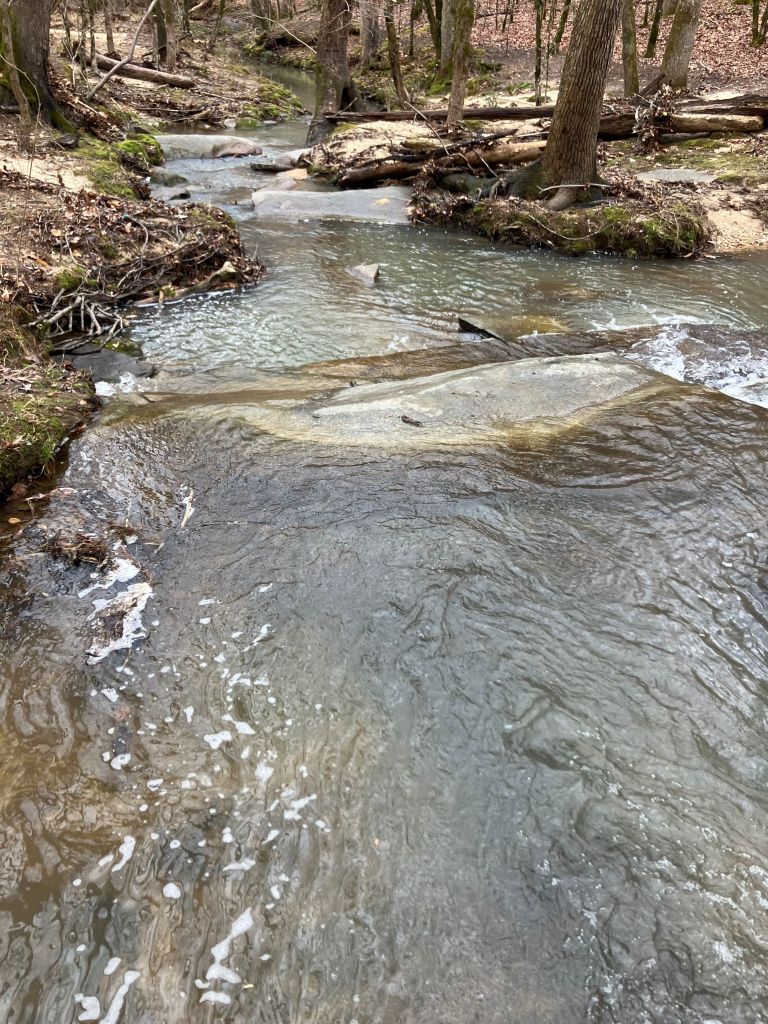 Water rippling over a wide rock shelf