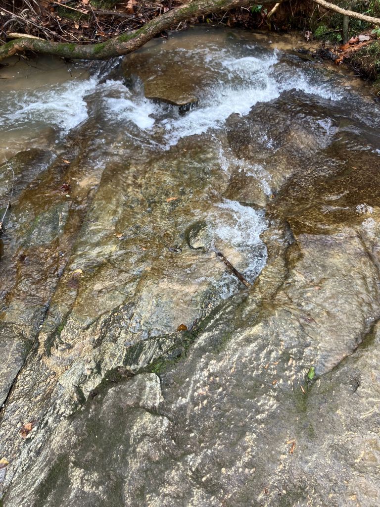 Water cascading over sloping rock