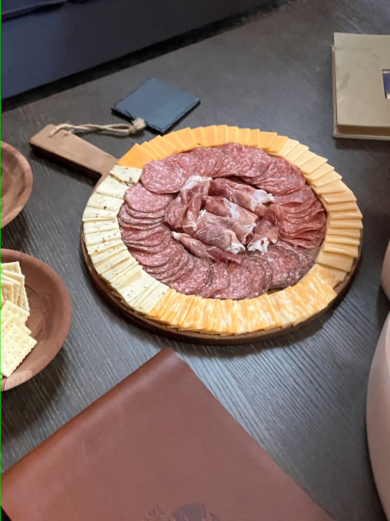 Round platter of sliced meats and cheese