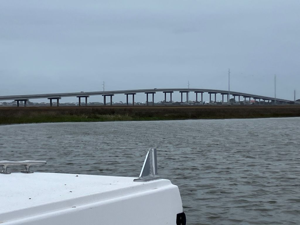 Long bridge across the water seen from the boat