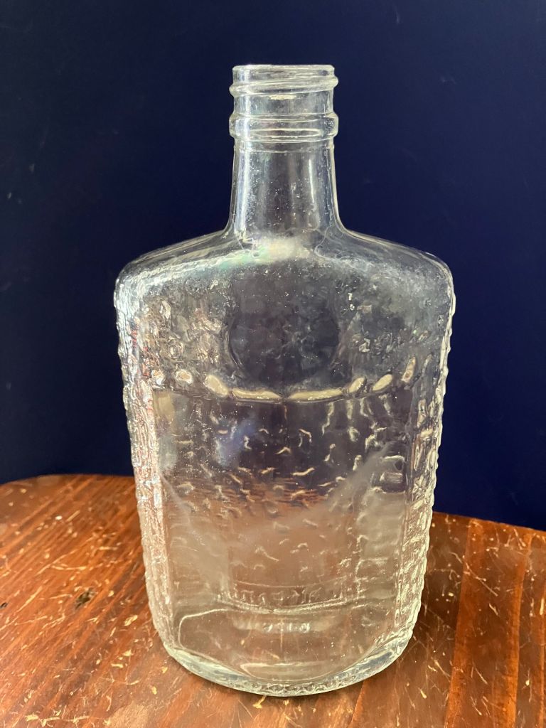 Front view of the textured glass flask