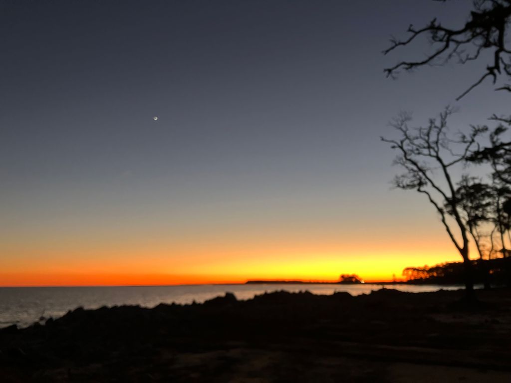 Twilight glow and the evening star over the water