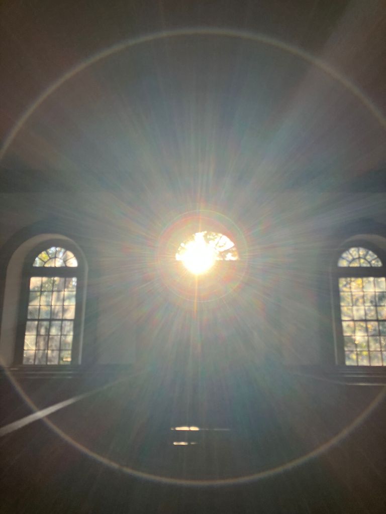 Sunburst light shining inside St. James Santee, the brick church at Wambaw