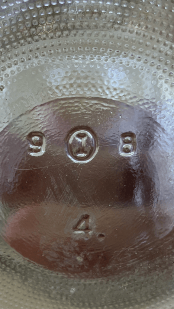 Close view of the embossed numbers on the bottle base