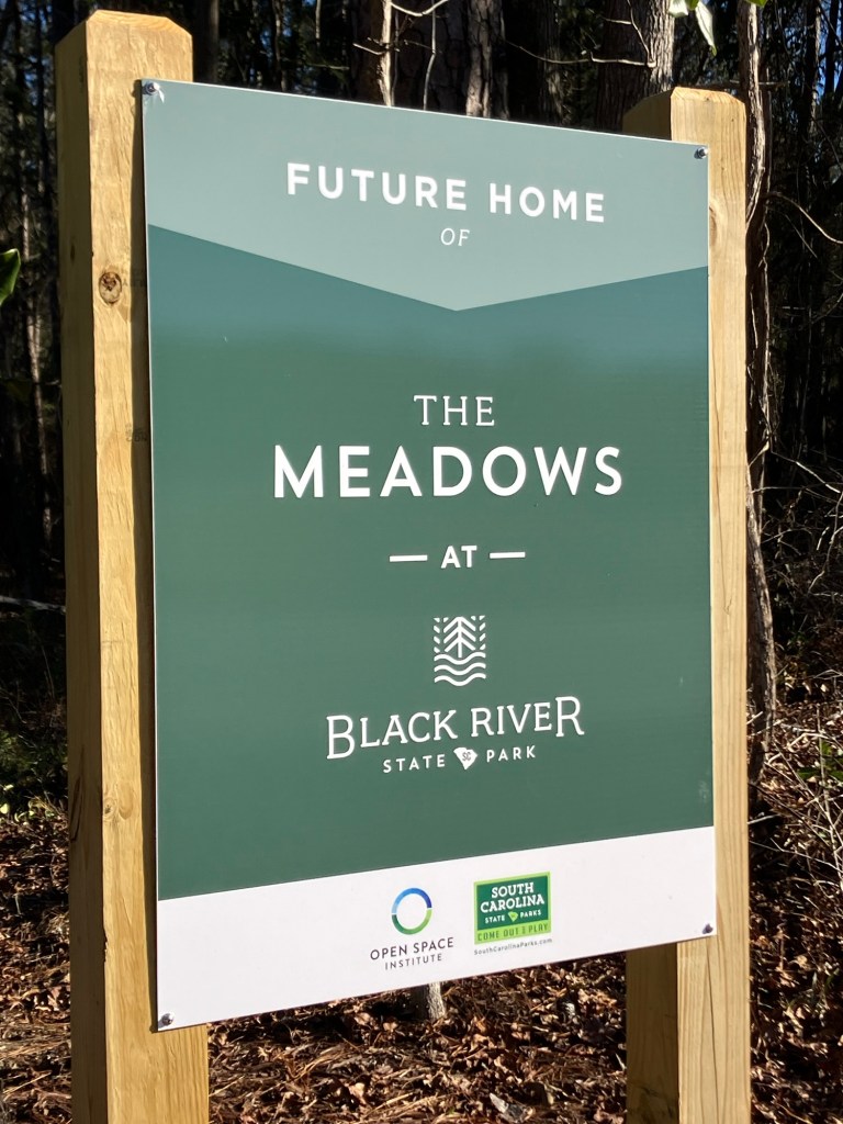 Sign reading Future Home of The Meadows at Black River State Park